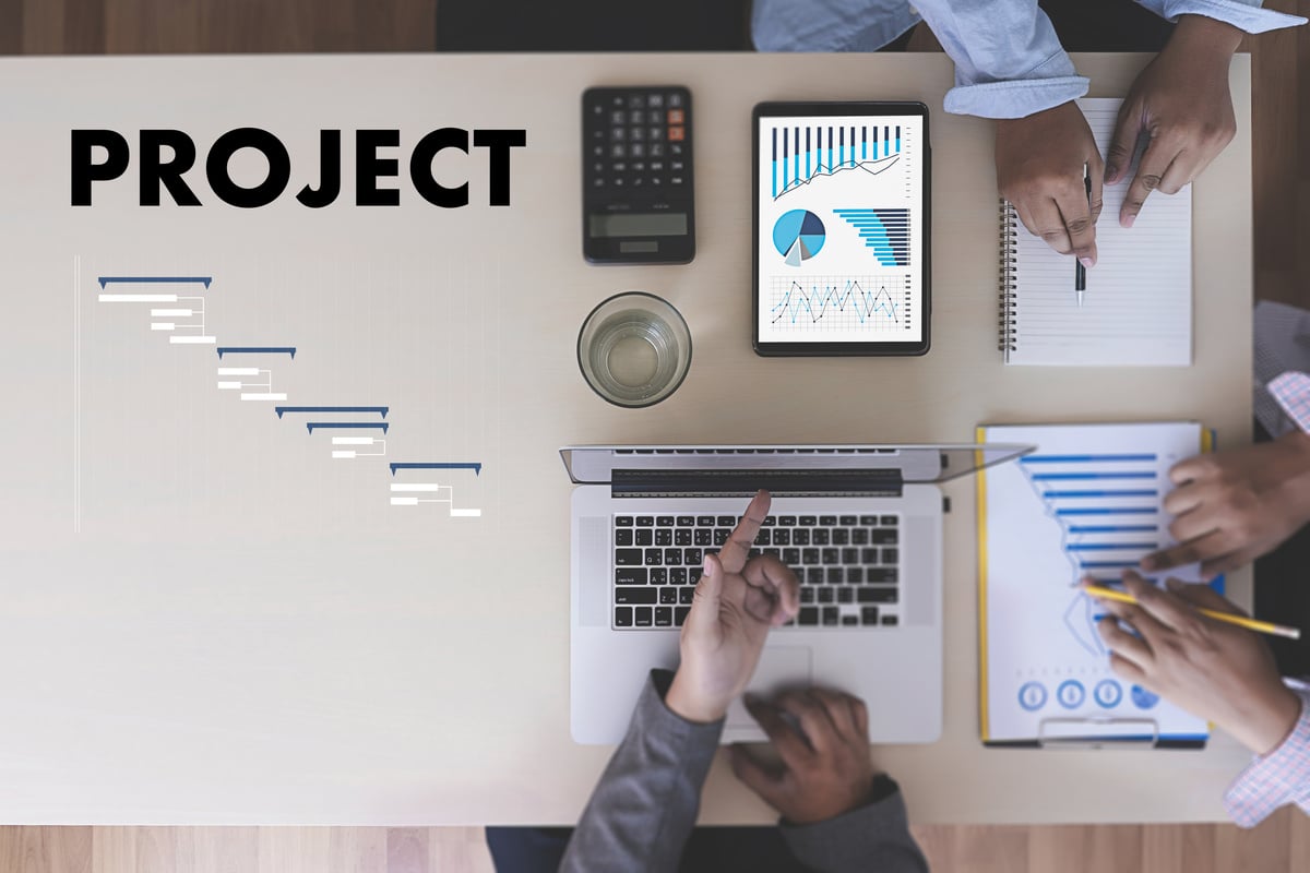 Business People Analyzing  PROJECT MANAGEMENT updating Gantt chart